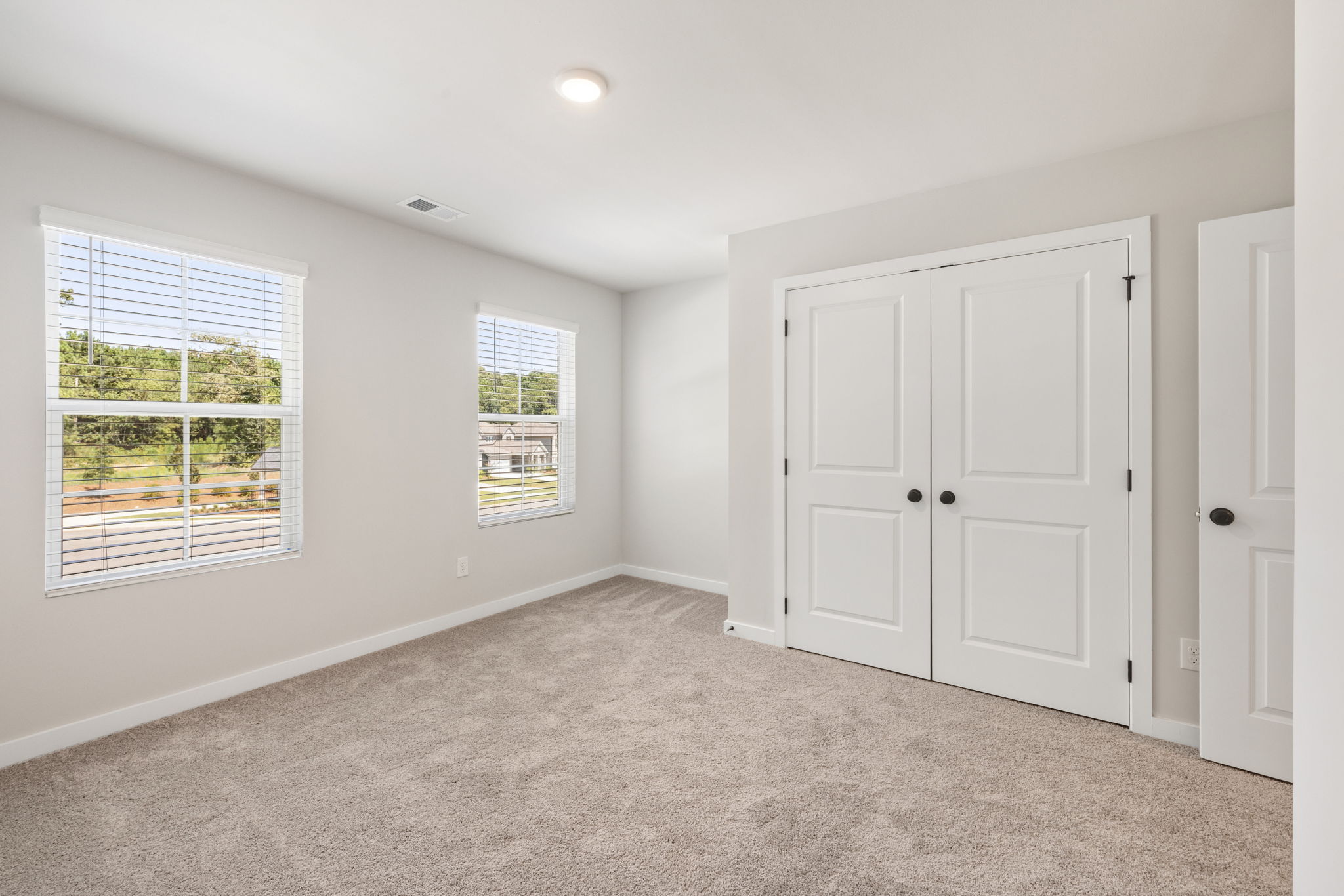 A room with white doors and windows.
