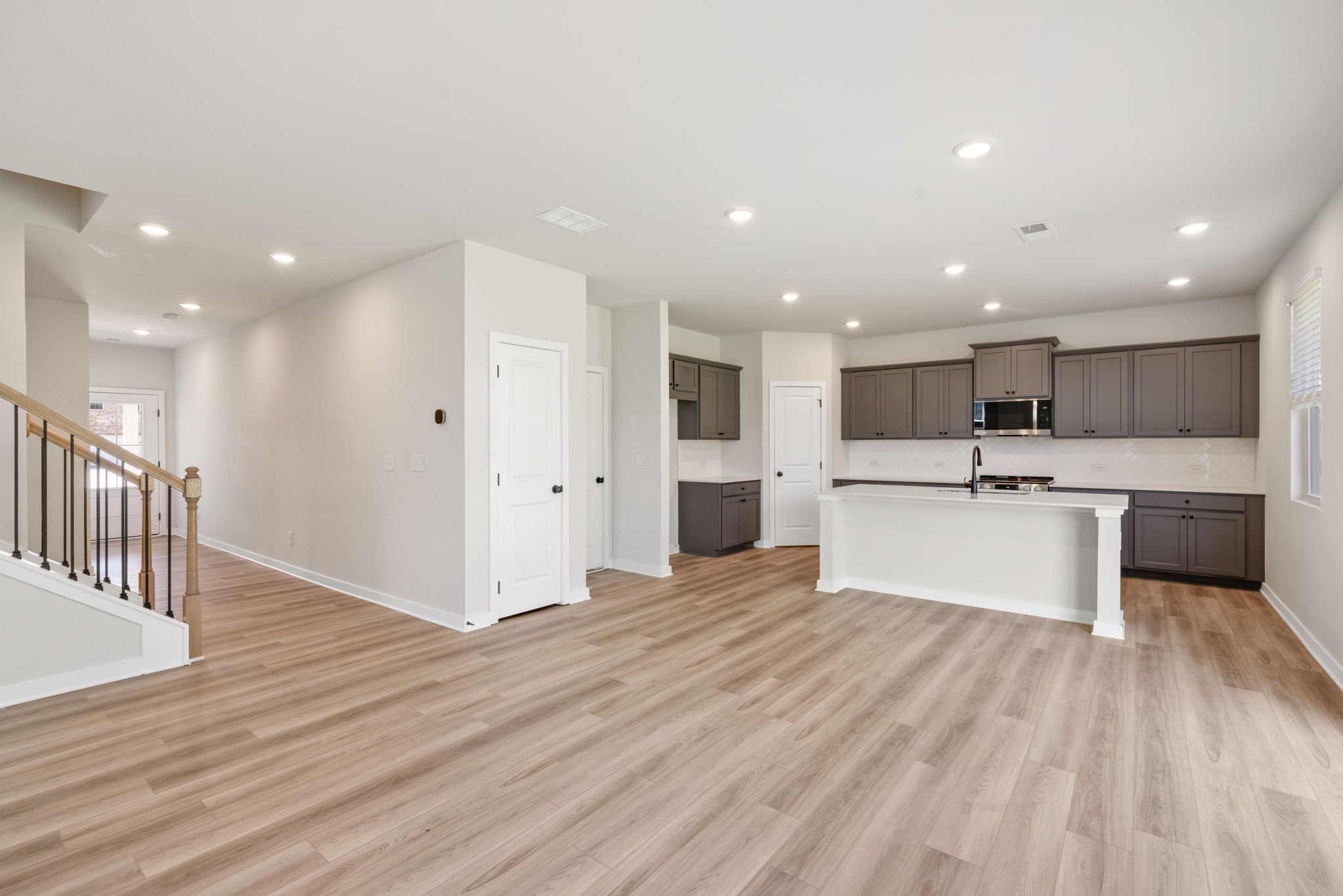 A large kitchen with white cabinets.