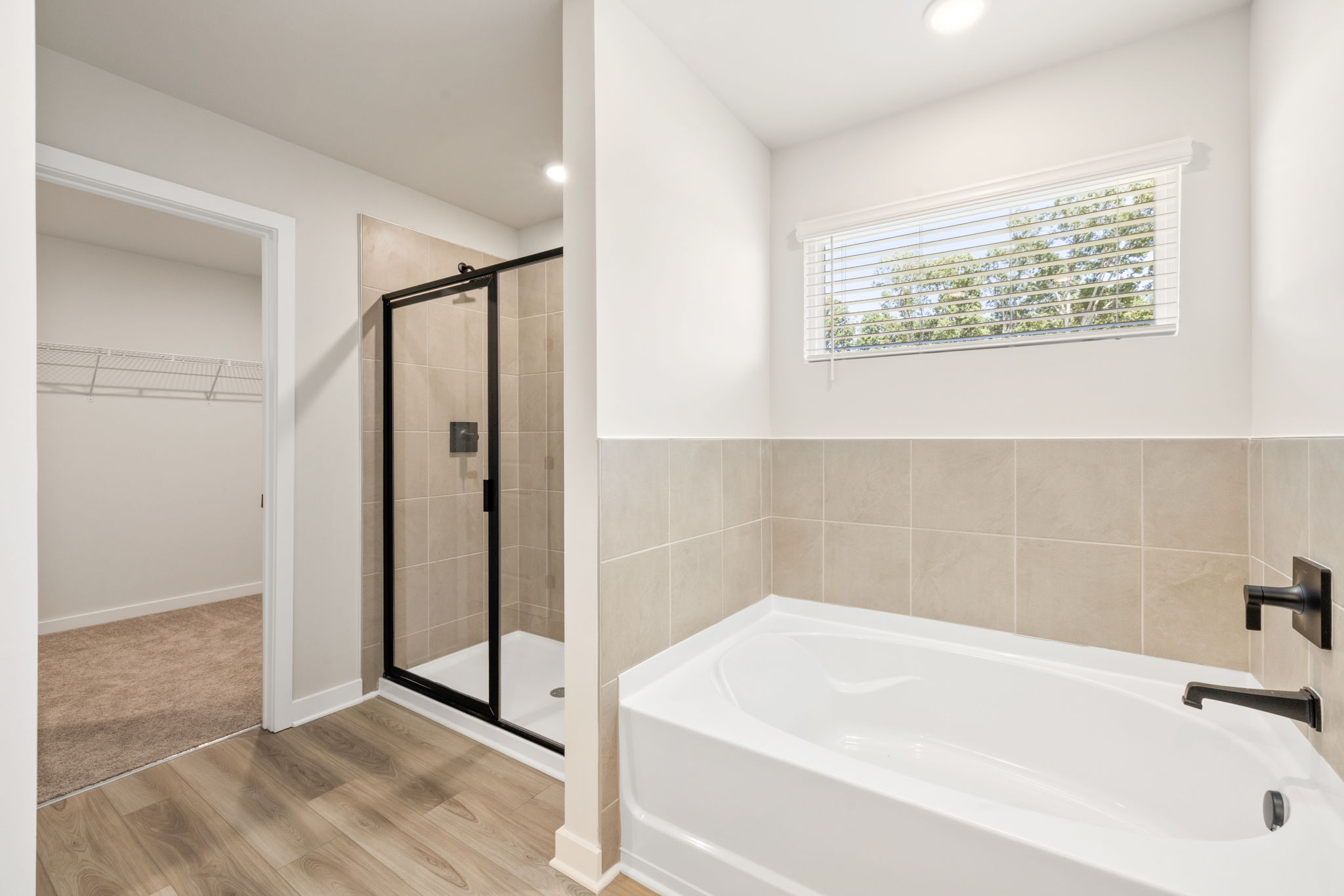 A bathroom with a tub and shower.