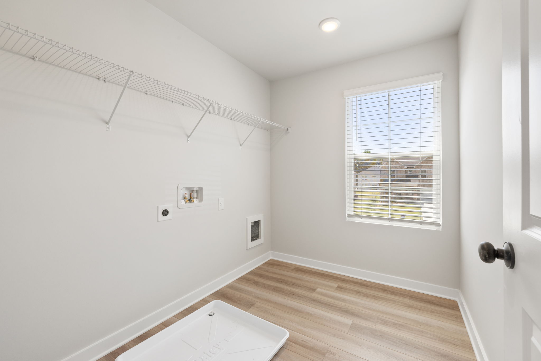 A room with a window and a table.
