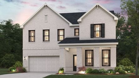 A grey house with a driveway.