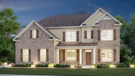 A large house with a lawn.