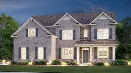 A large house with a lawn in front of it.