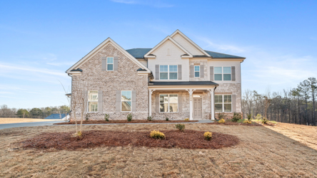 A house with a dirt yard.