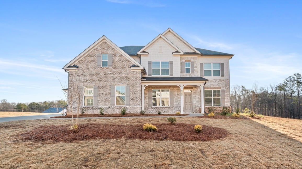 A house with a dirt yard.