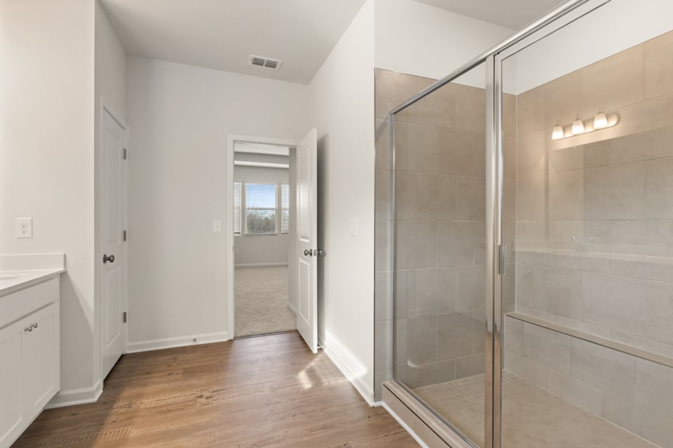 A bathroom with a glass shower.