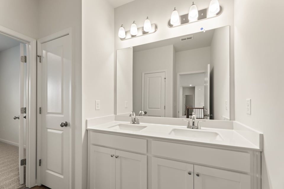 A bathroom with two sinks.