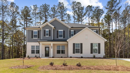 A house with trees in the back.