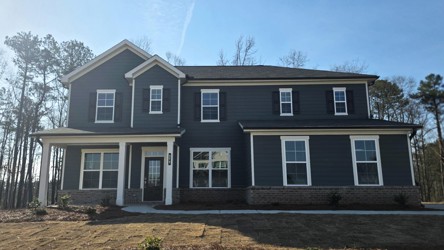 A house with a brick driveway.