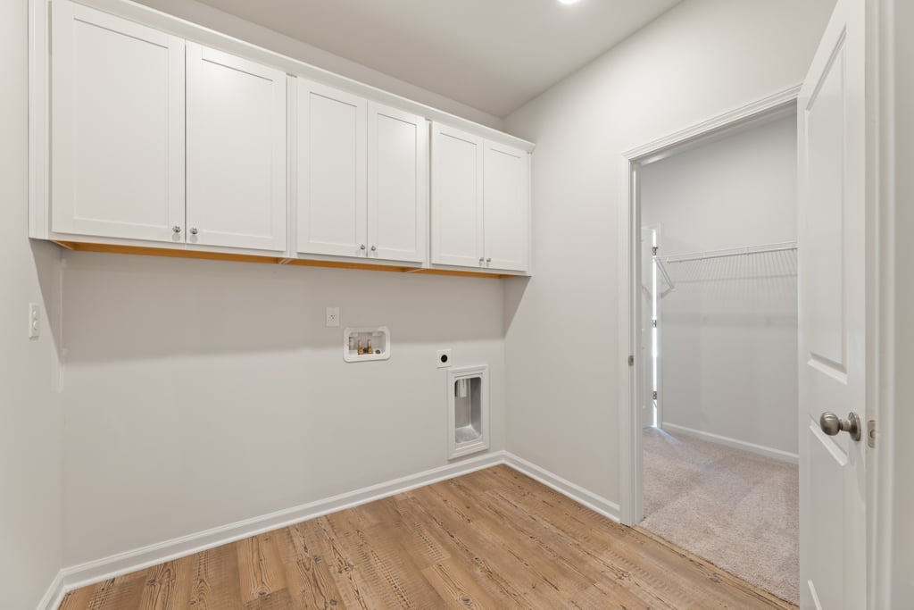 A room with white cabinets.