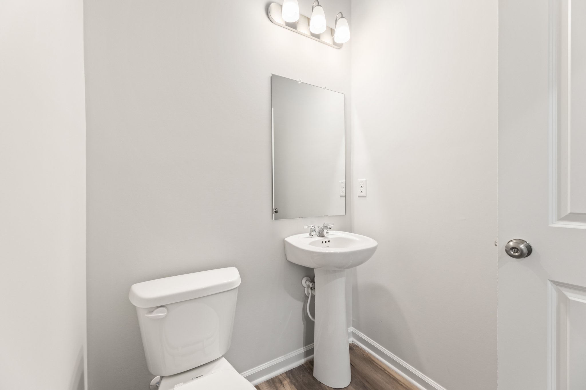 A bathroom with a sink and toilet.