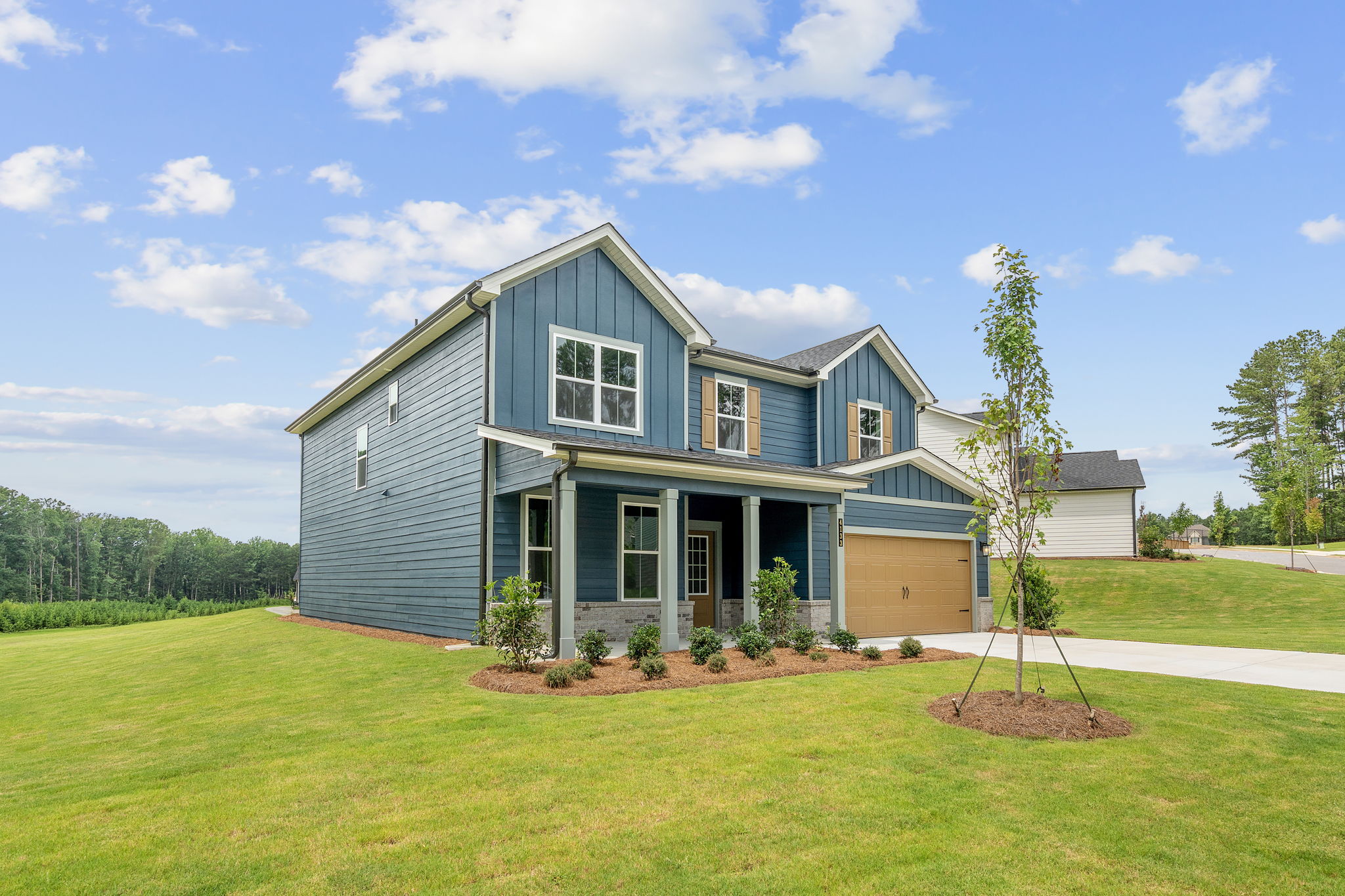 A house with a green lawn.