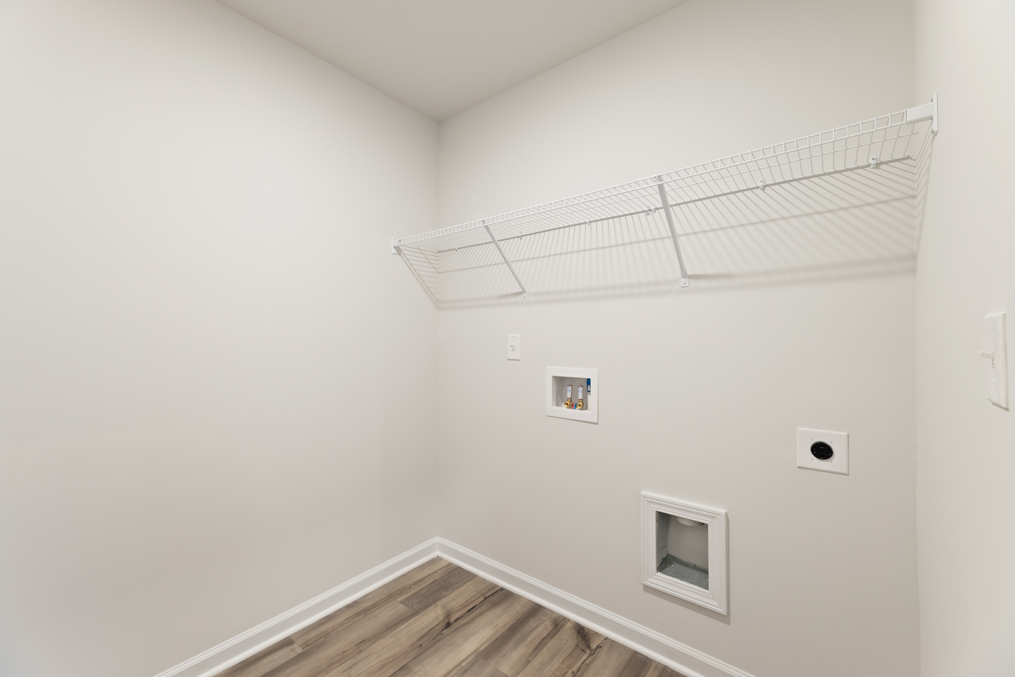 A white room with a vent.