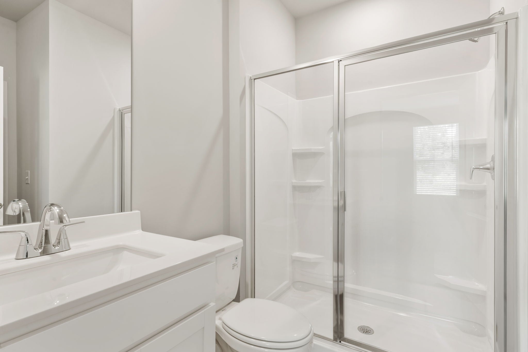 A bathroom with a glass shower.