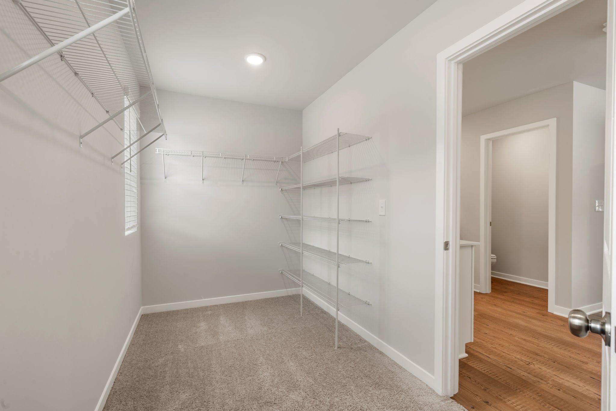 A room with a ladder and a door.