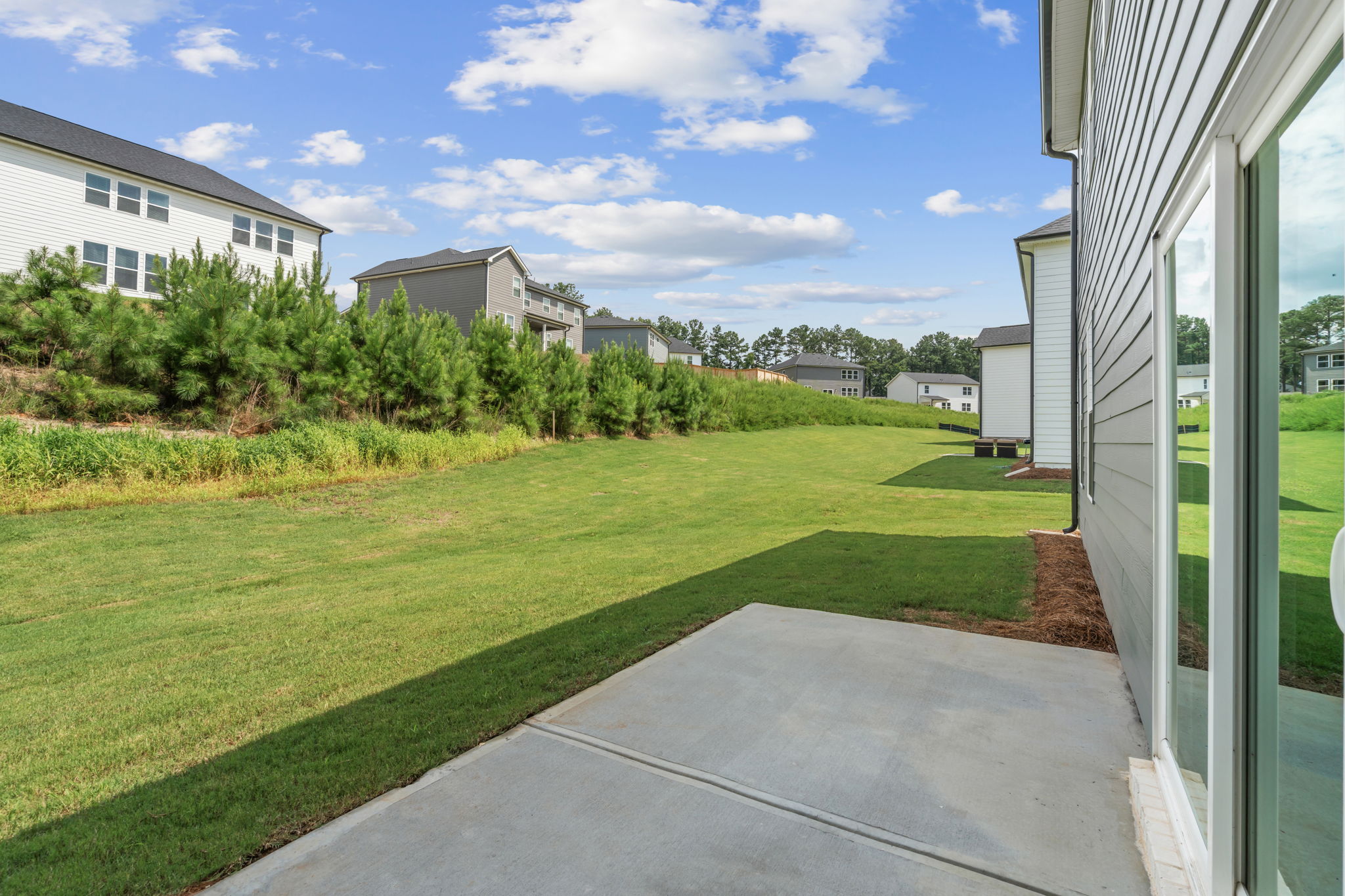 A house with a green lawn.