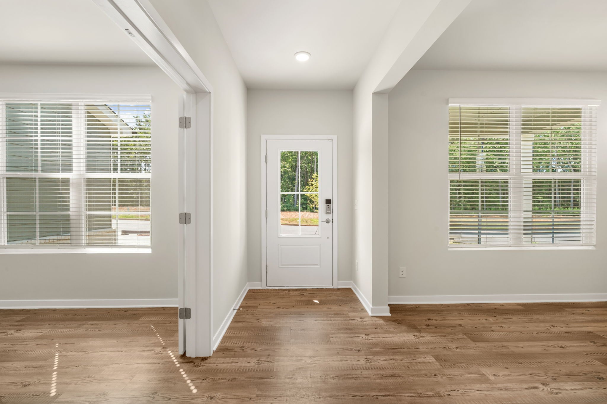A room with white walls and windows.