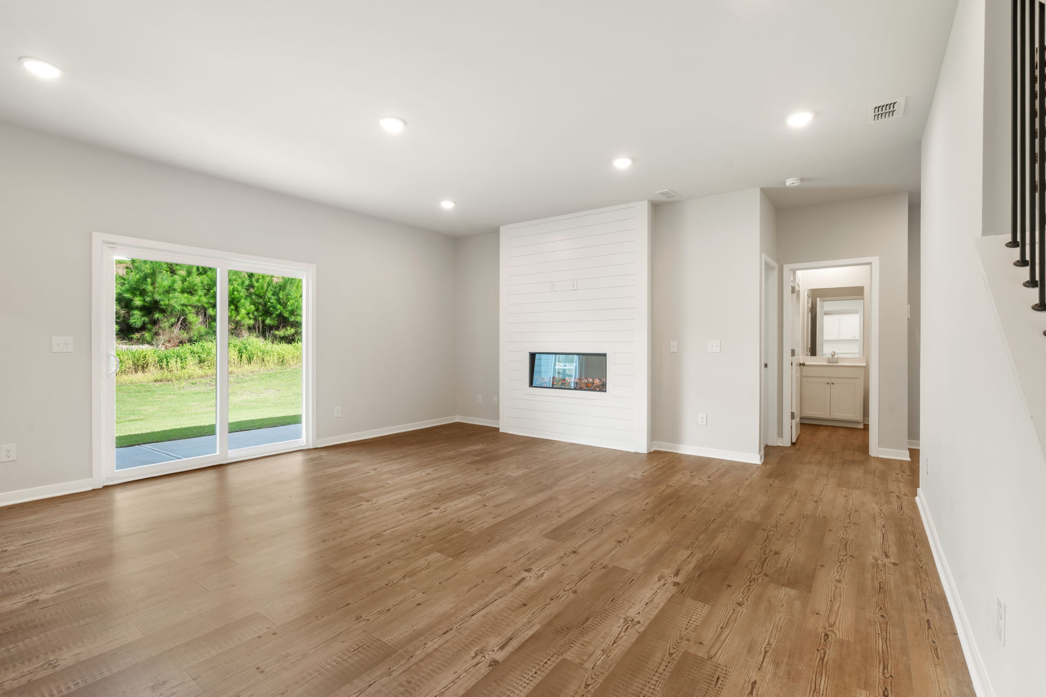 A room with a wood floor and a wood floor.