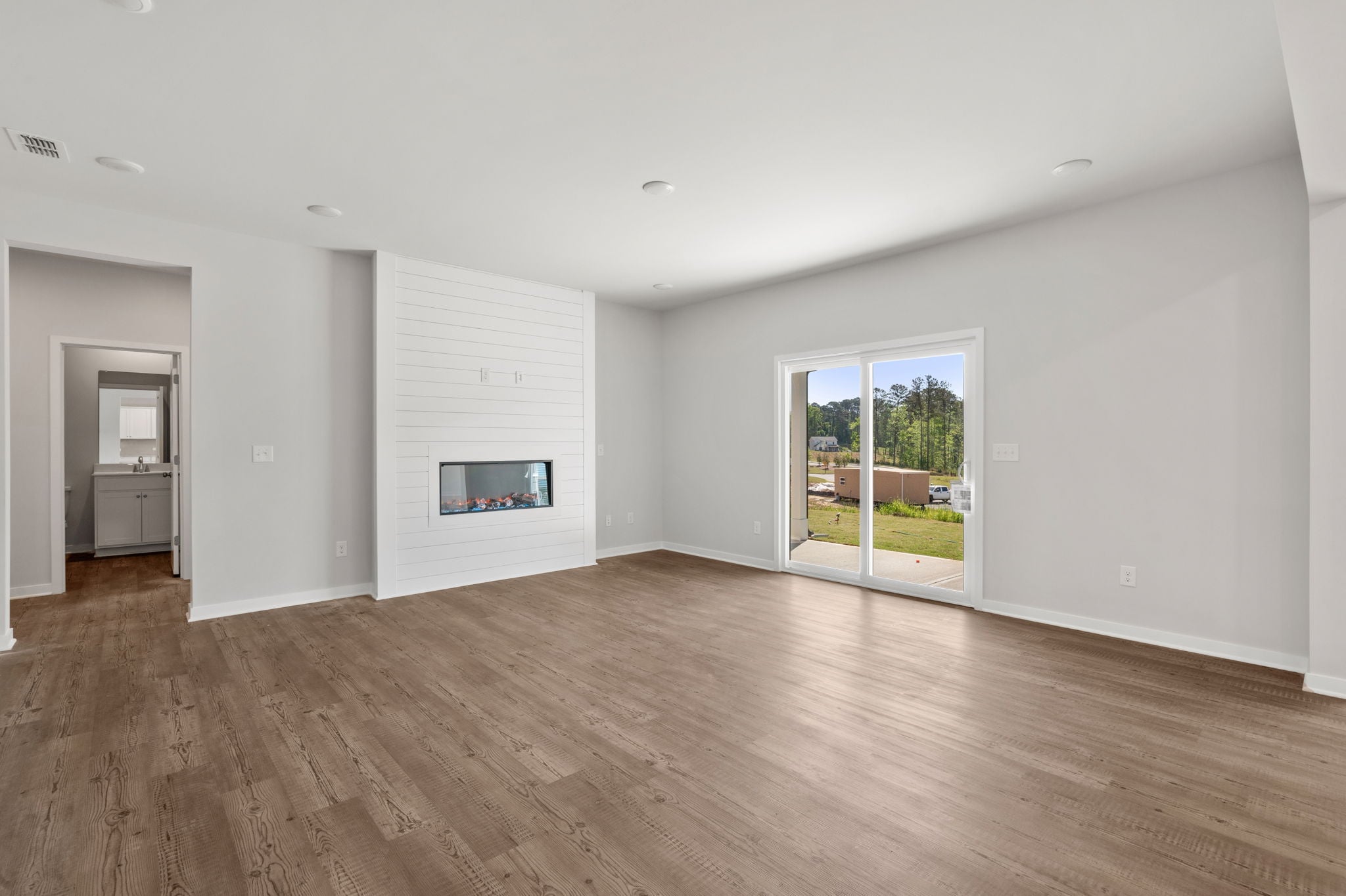 A room with a wood floor and a wood floor.