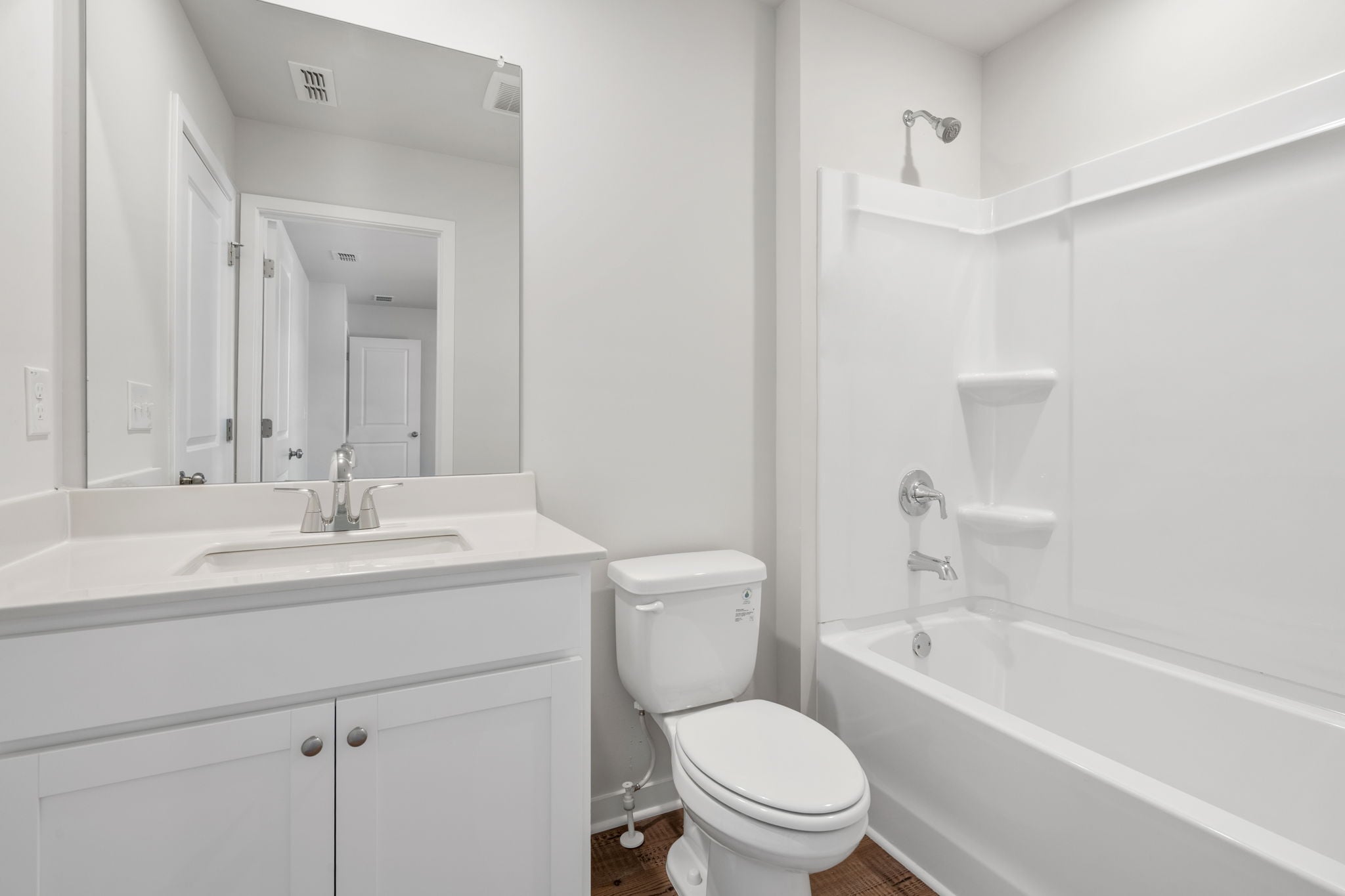 A bathroom with a toilet and sink.