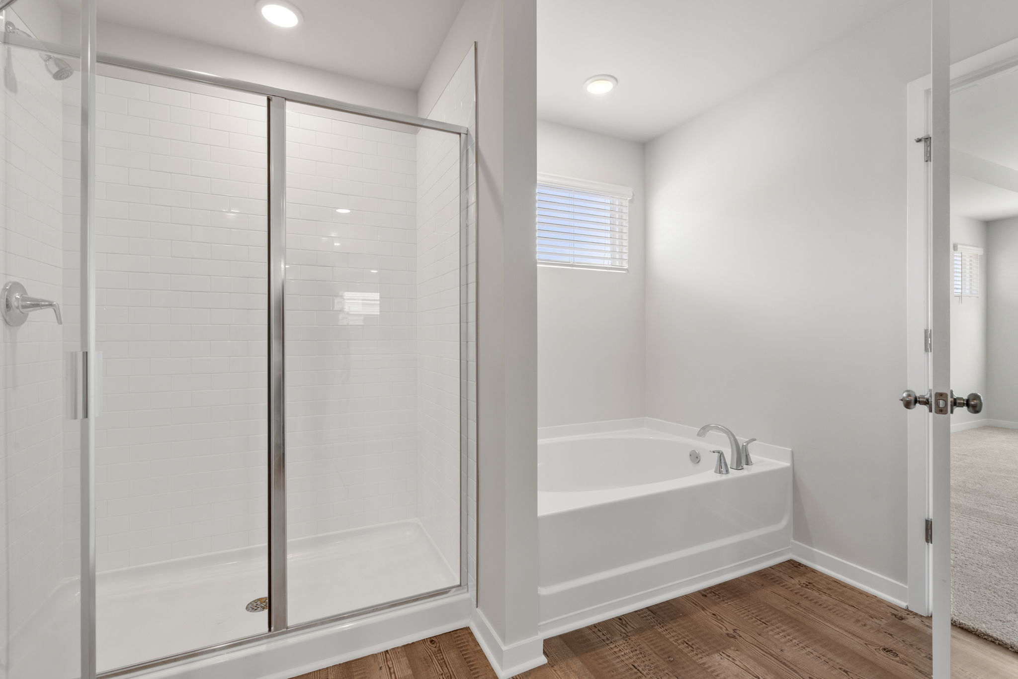 A bathroom with a glass shower.