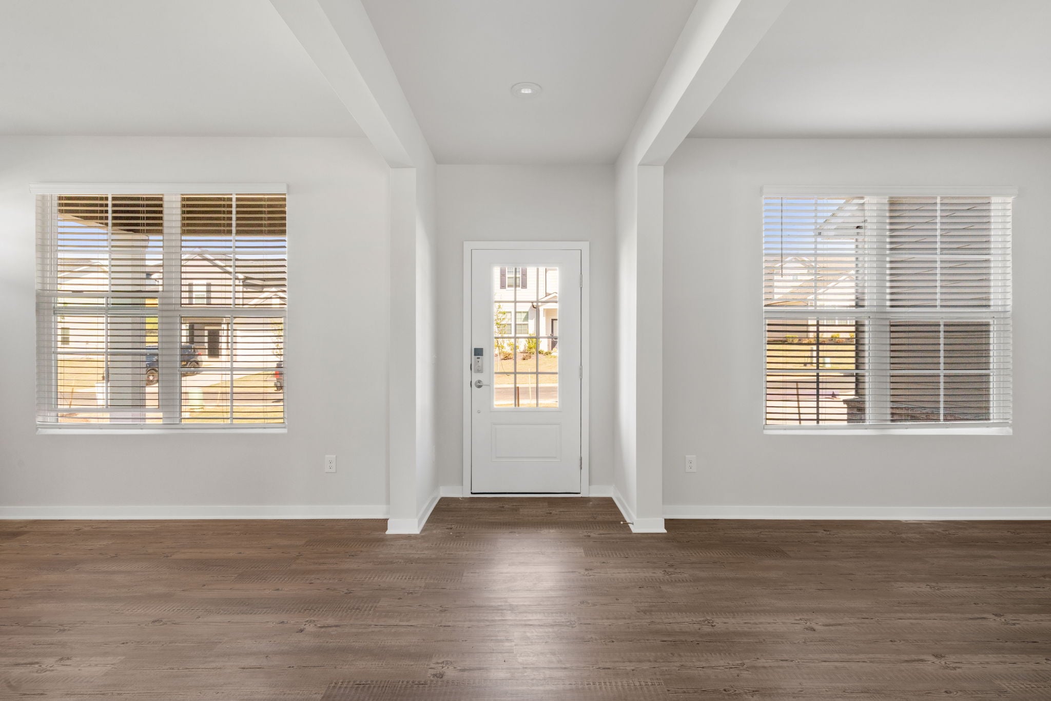 A room with a door and windows.
