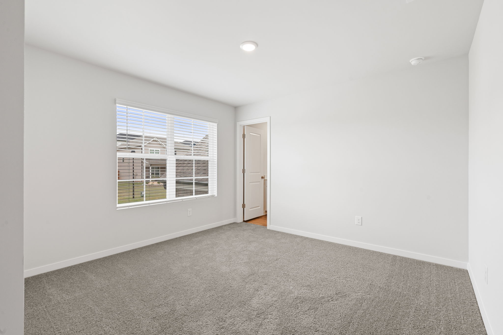 A room with a door and a window.