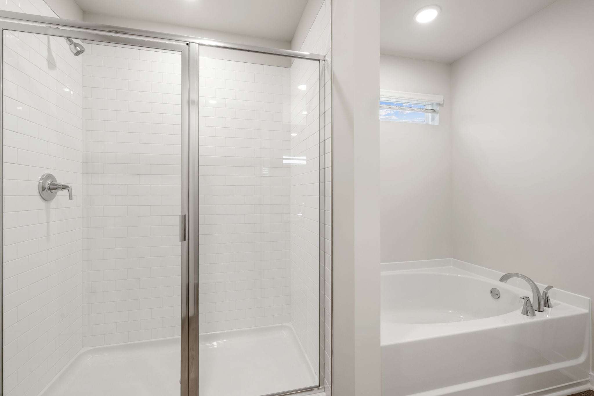 A bathroom with a glass shower.
