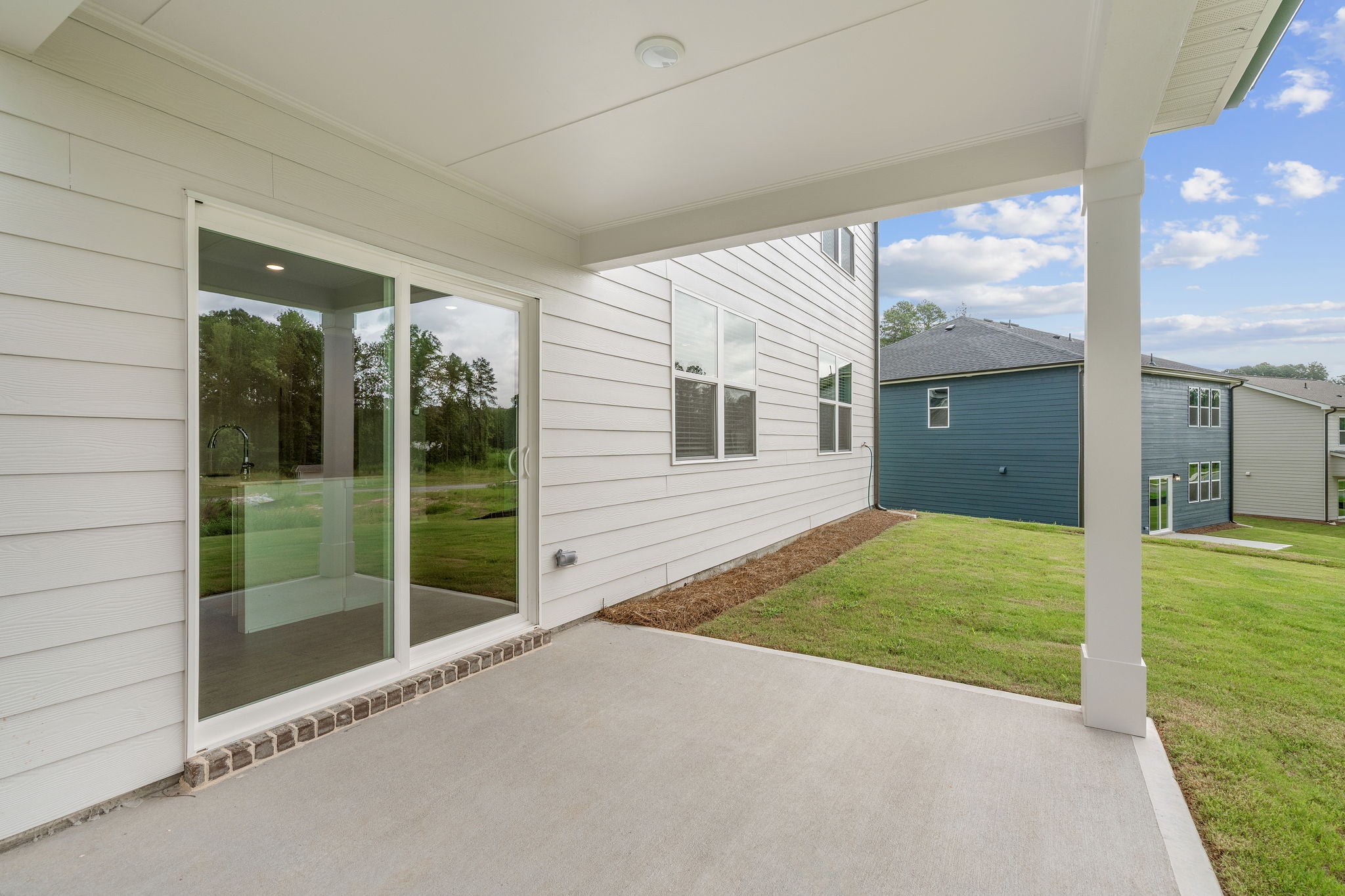 A white house with a glass door.