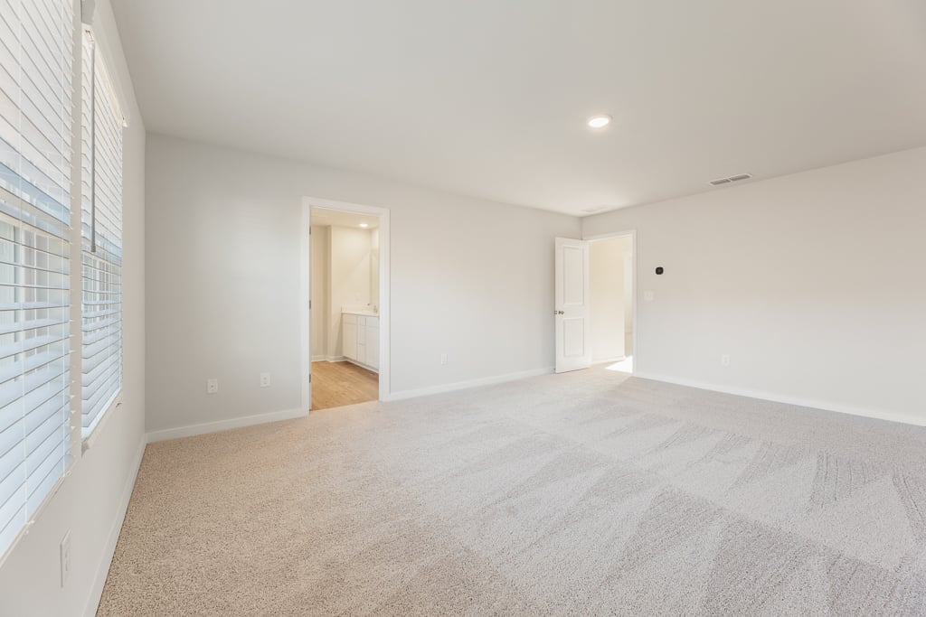 A long hallway with white walls.