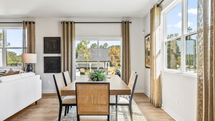 A dining room with a large window.