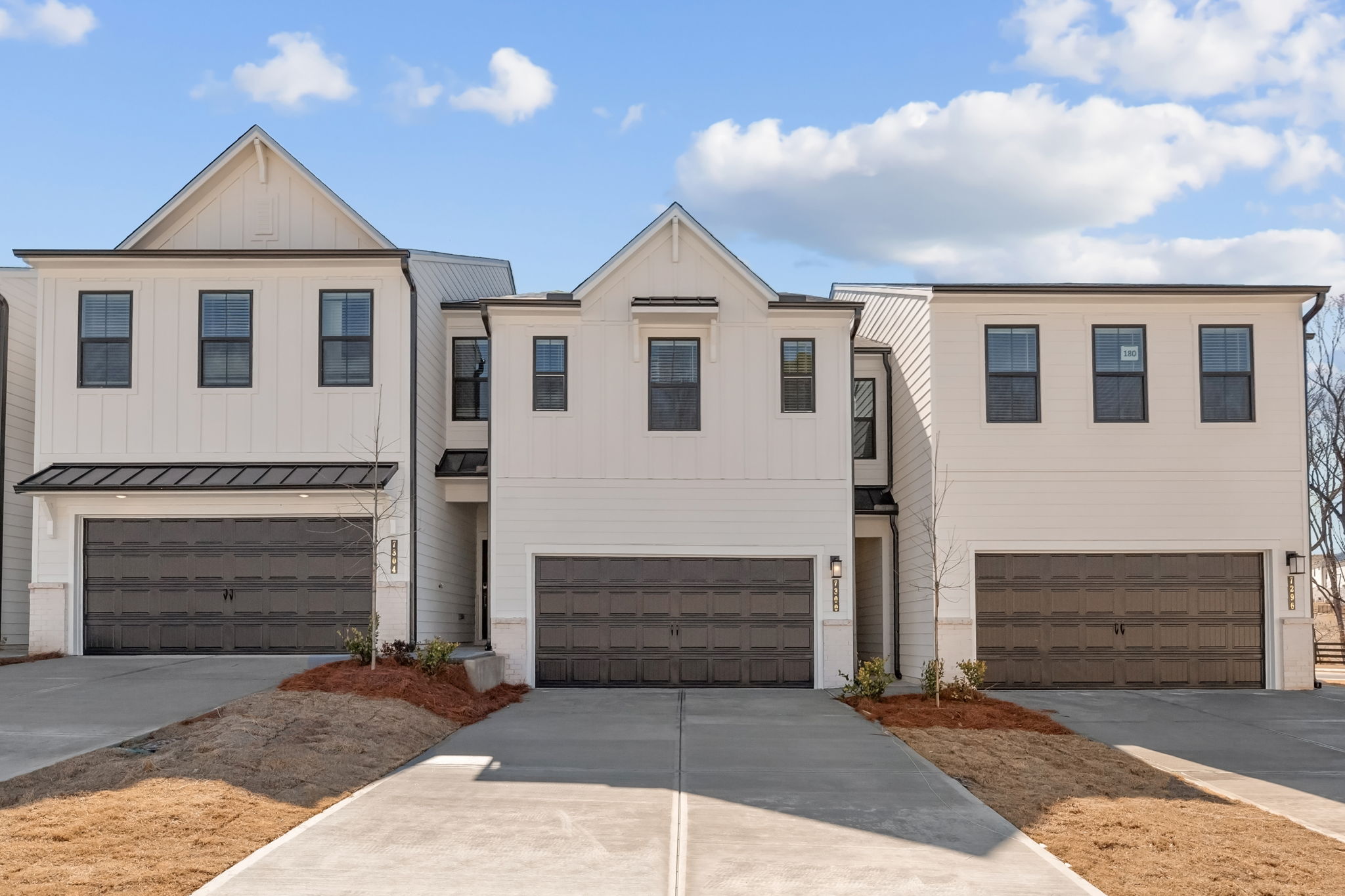 A building with garages and a driveway.