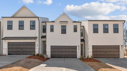 A building with garages and a driveway.