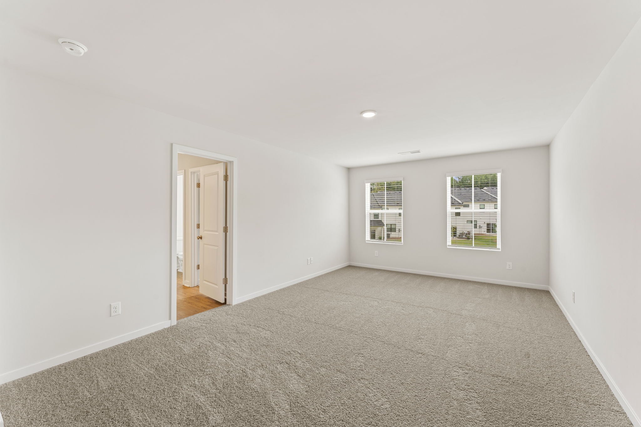 A room with a door and windows.