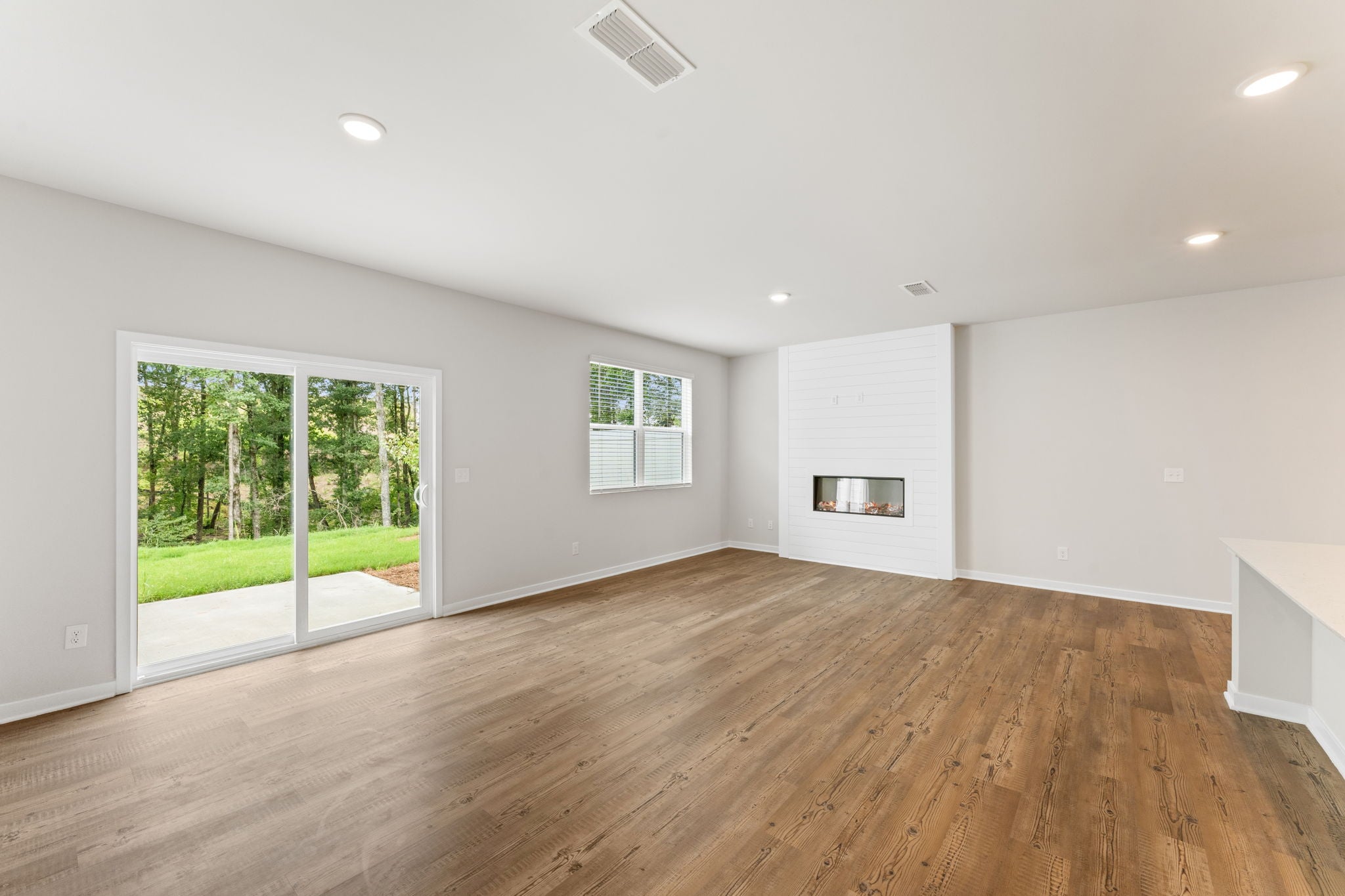 A room with a wood floor and a wood floor.