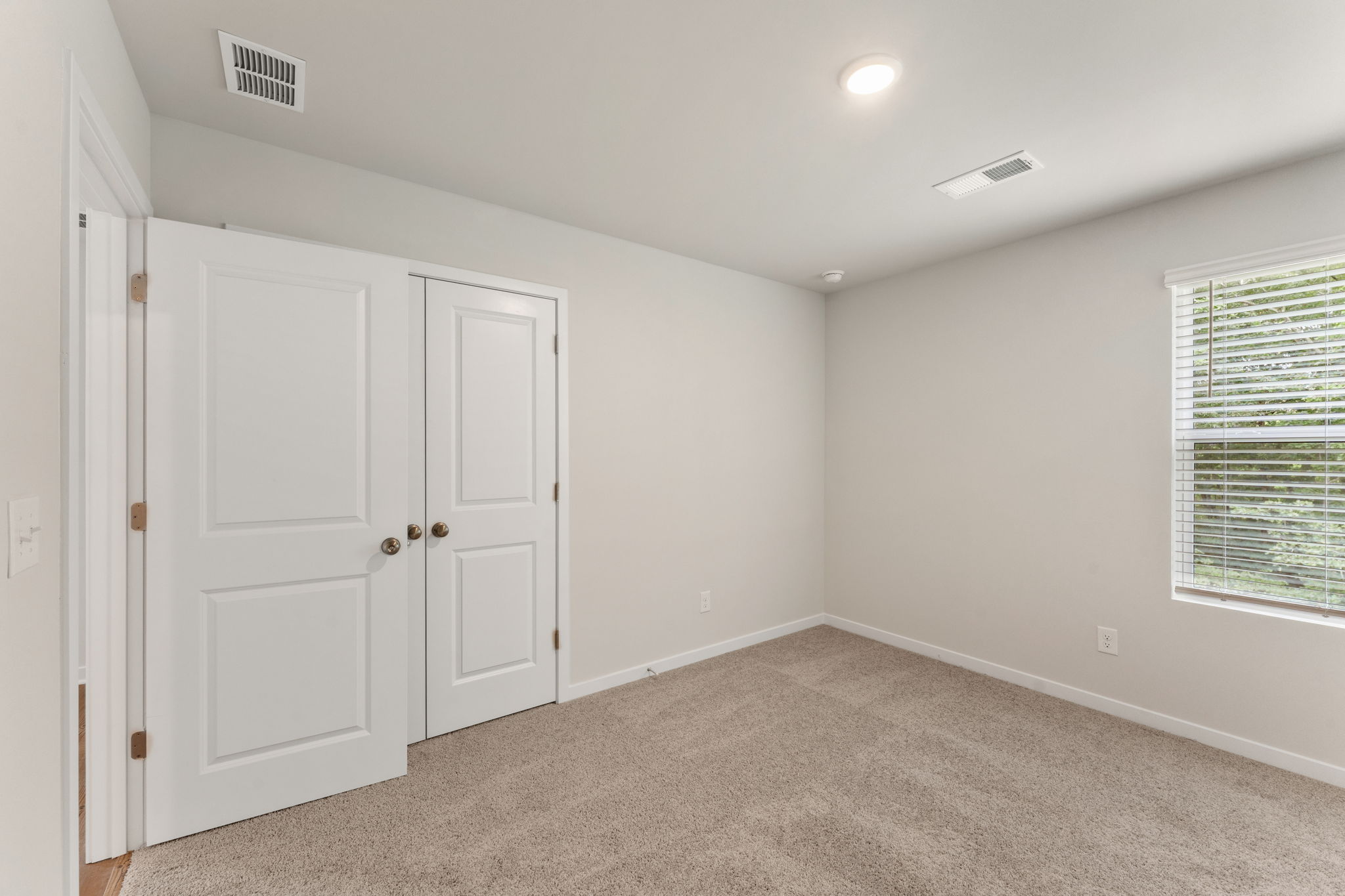A room with white doors.