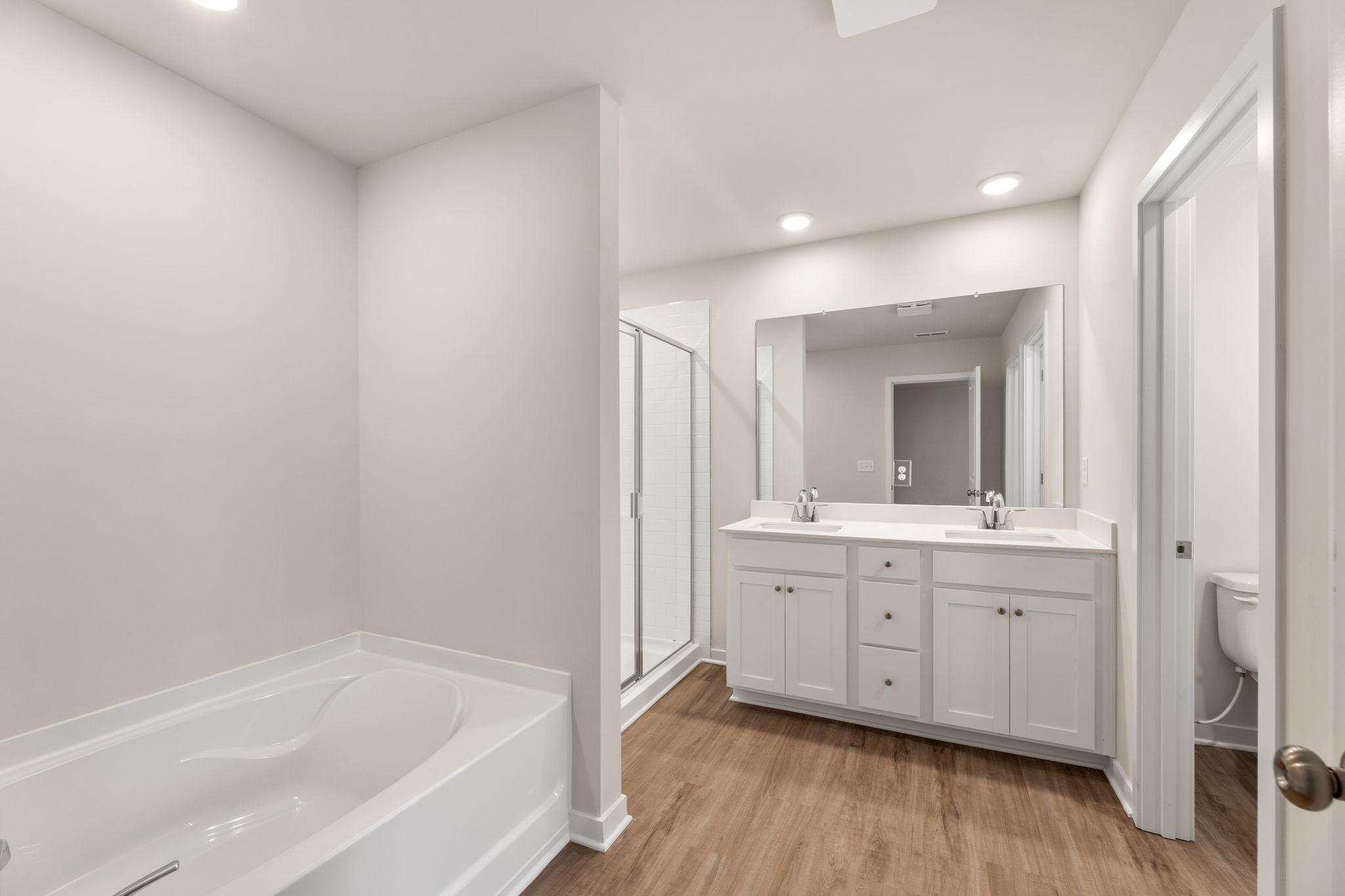 A bathroom with a tub and sink.