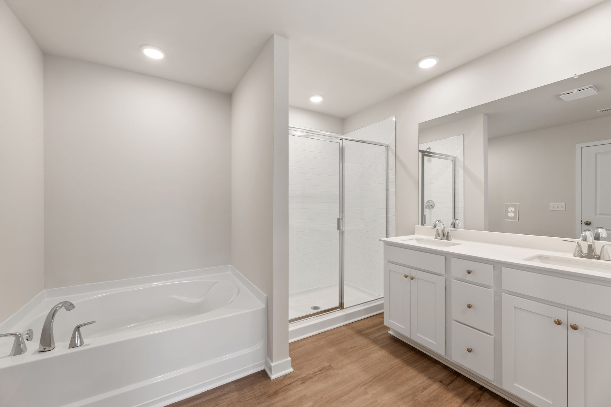 A bathroom with a tub and sink.