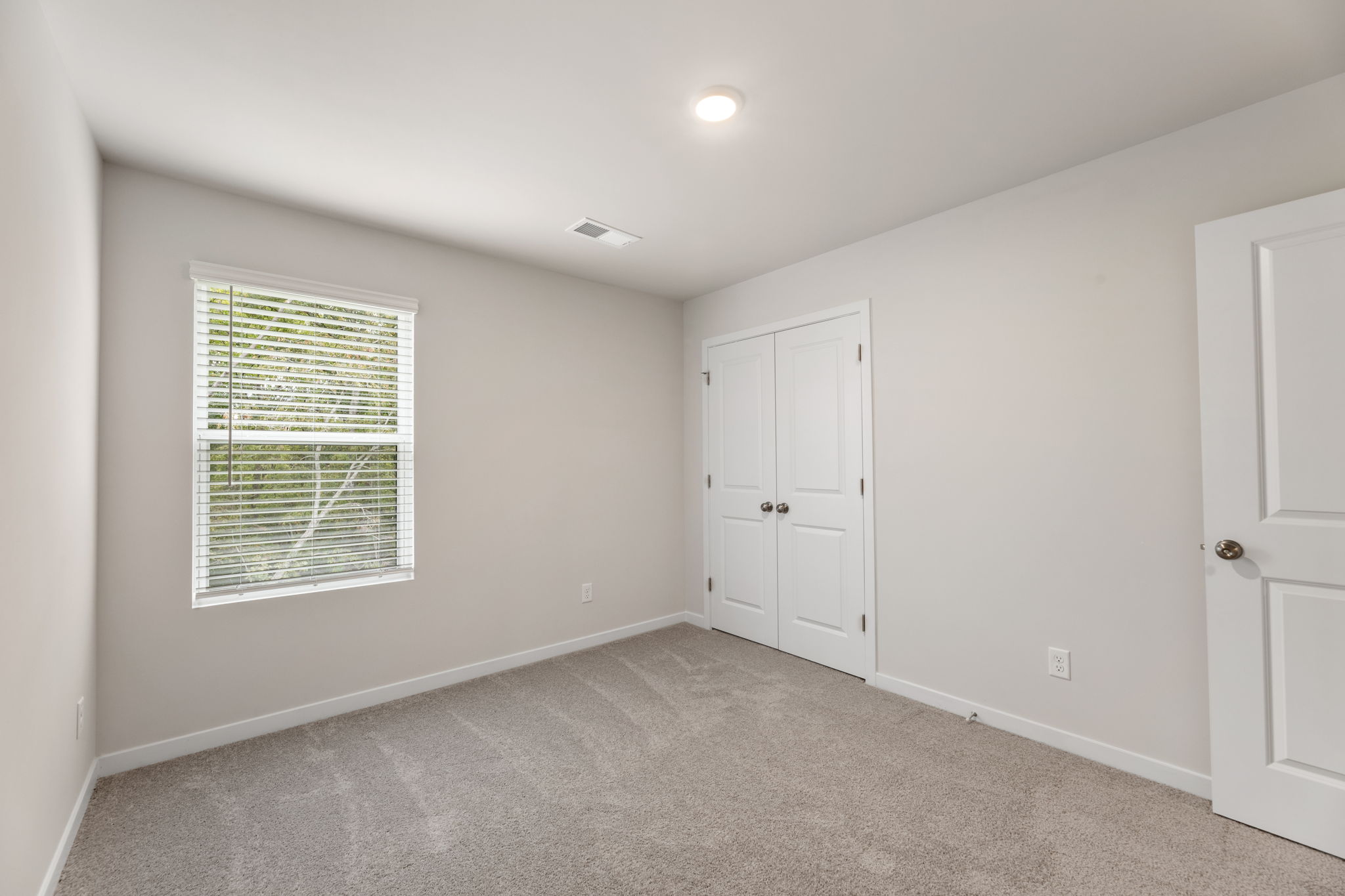 A room with white doors.