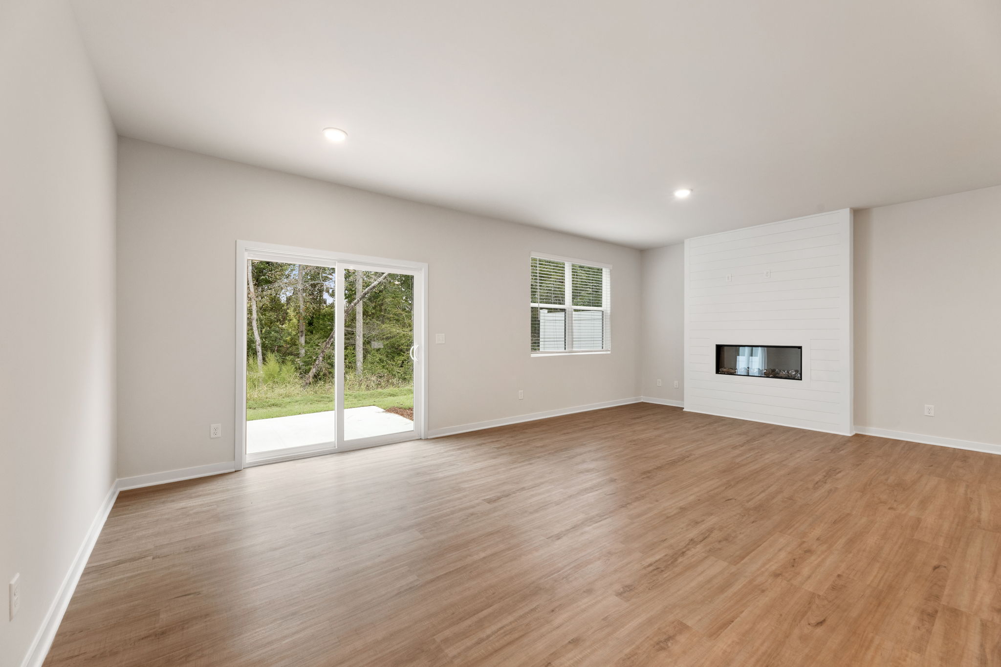 A room with a wood floor and a wood floor.