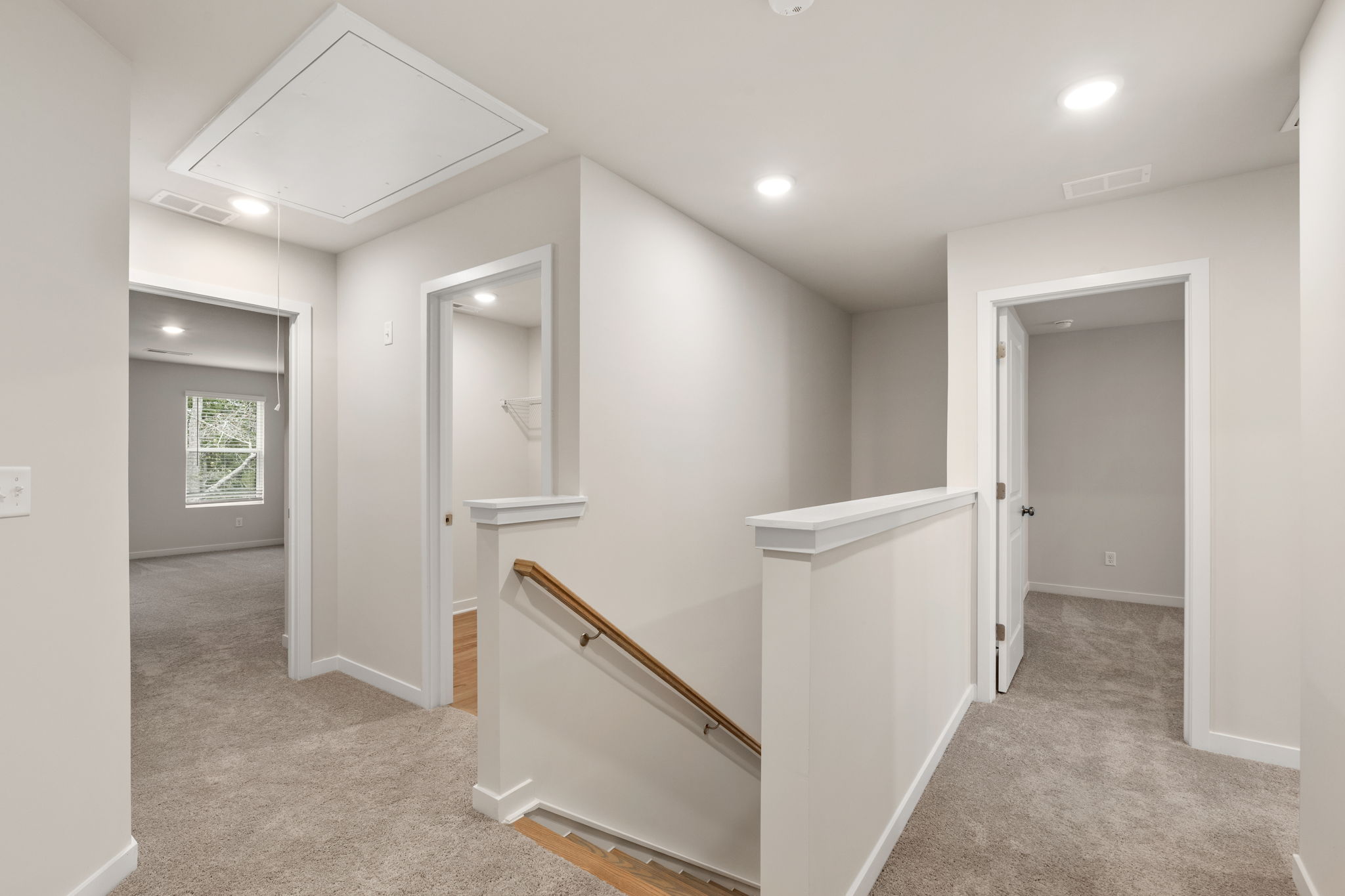 A bathroom with white walls.