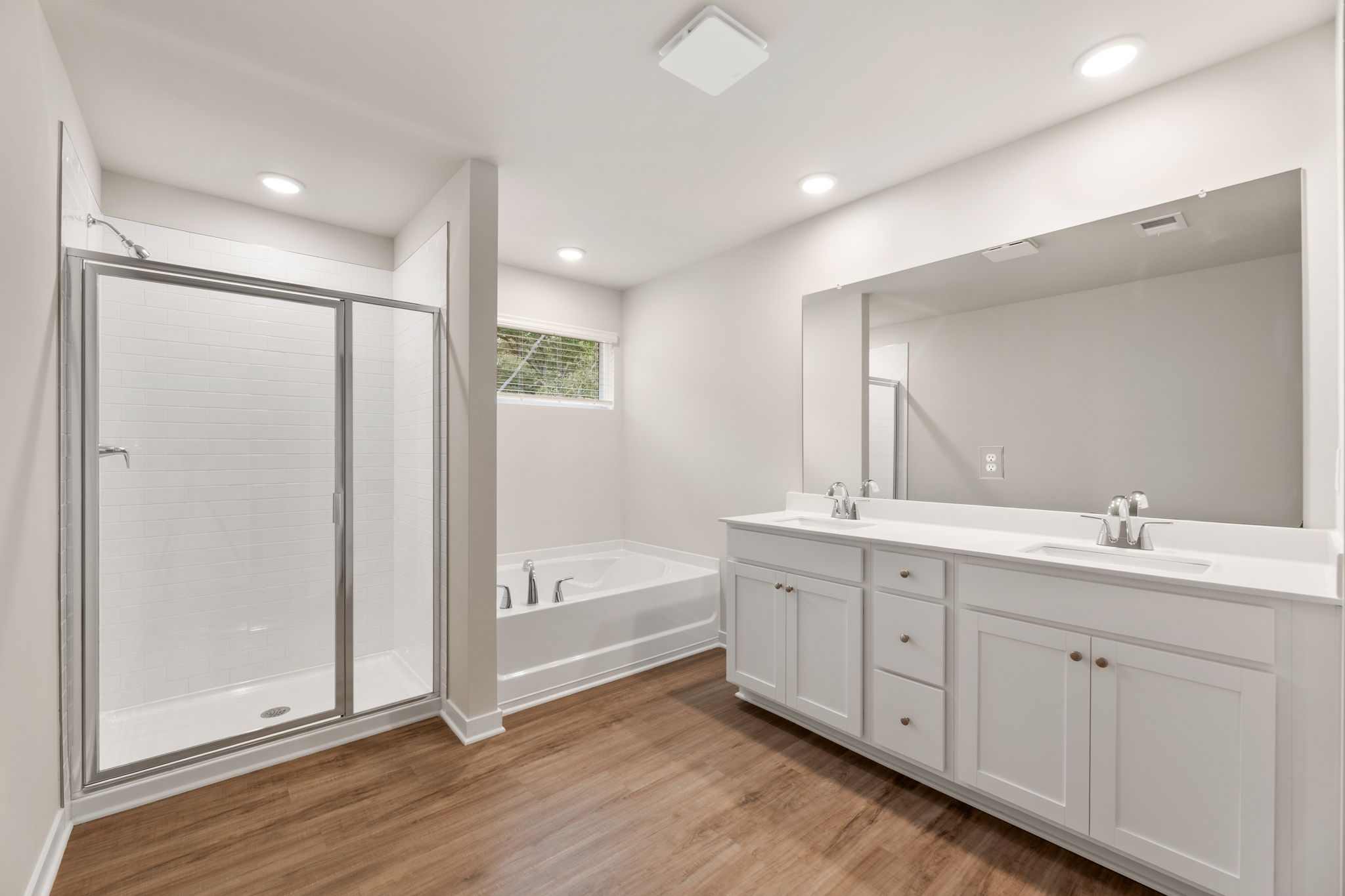 A bathroom with a tub and sink.