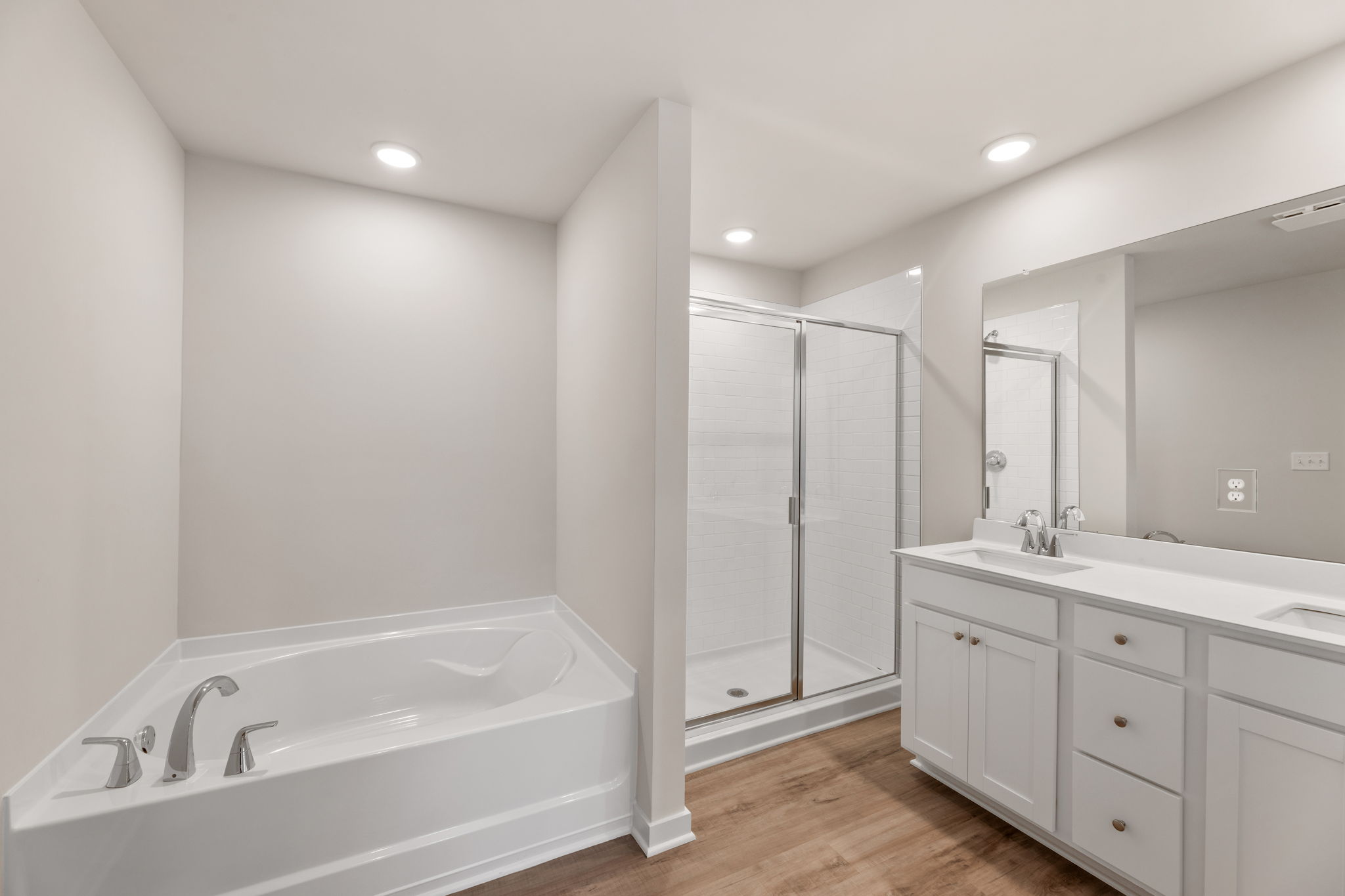 A bathroom with a tub and sink.