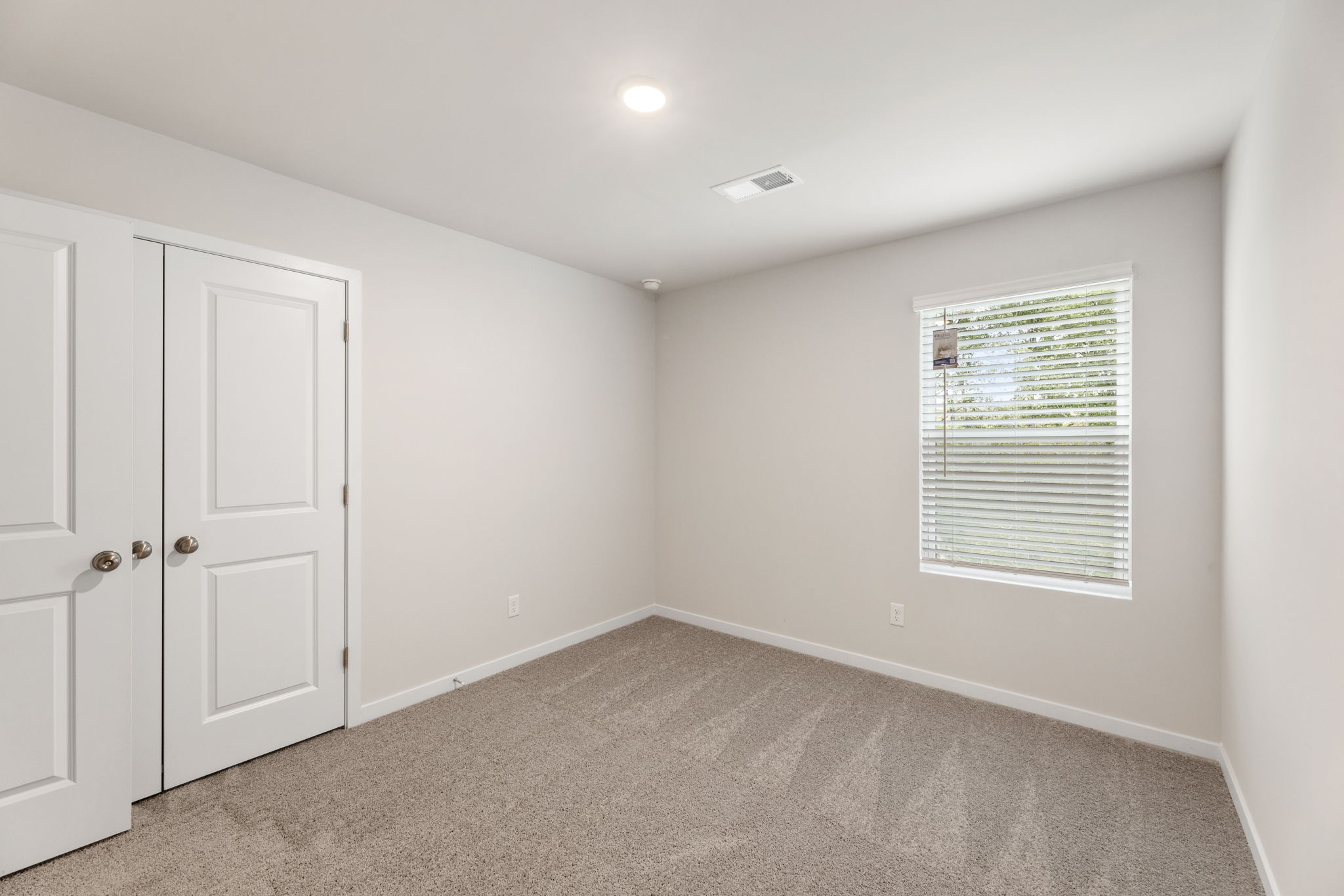 A room with white doors.