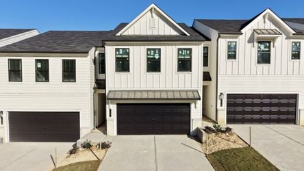 A white house with a garage.