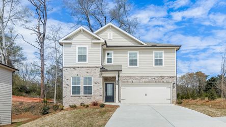 A white house with a garage.