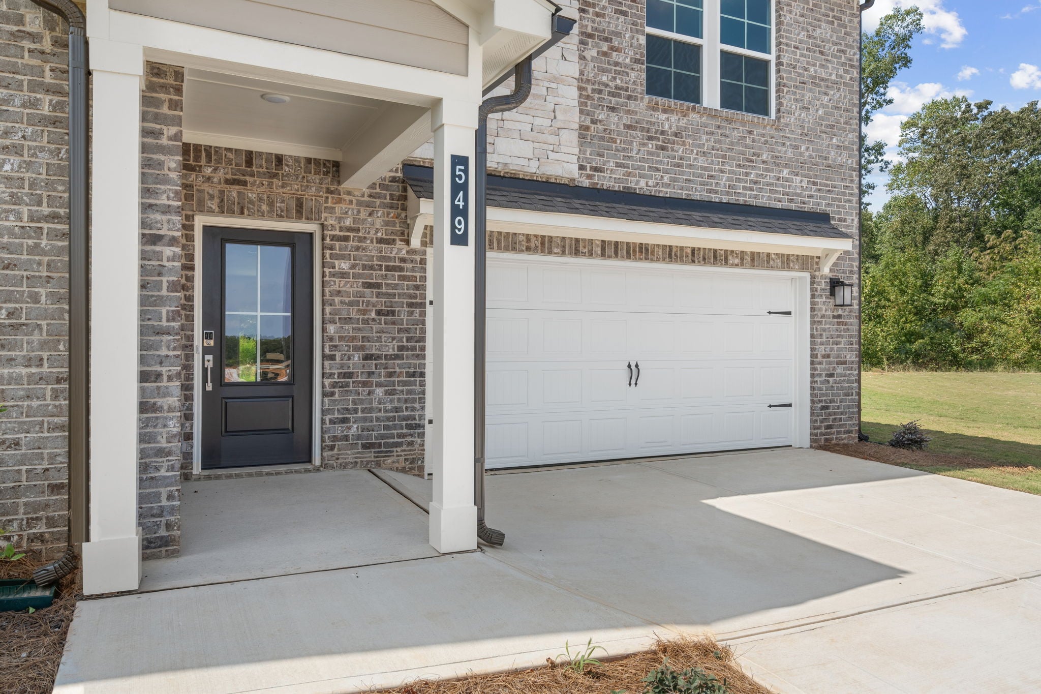 A garage door and a garage.