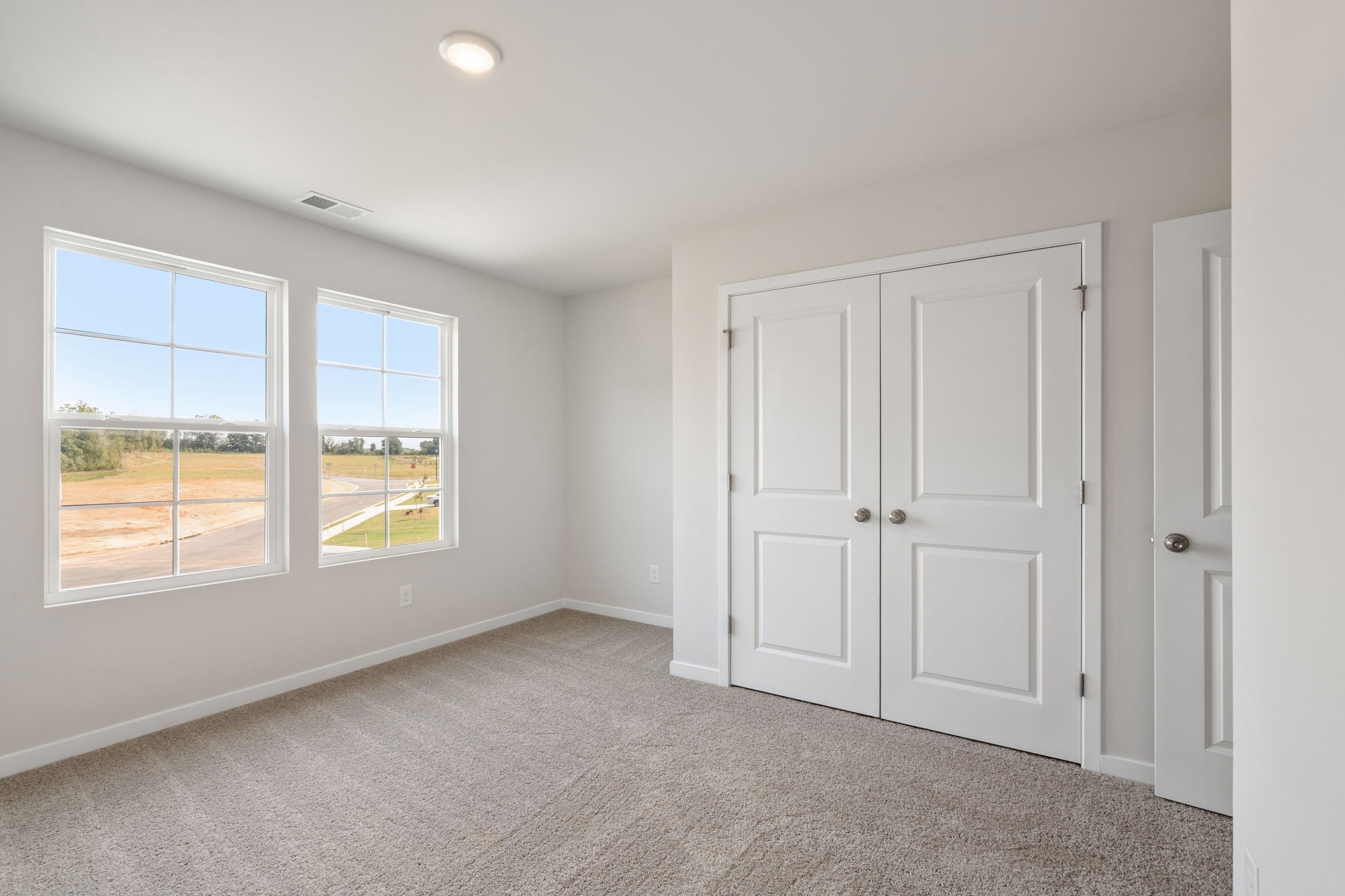 A room with white doors and windows.
