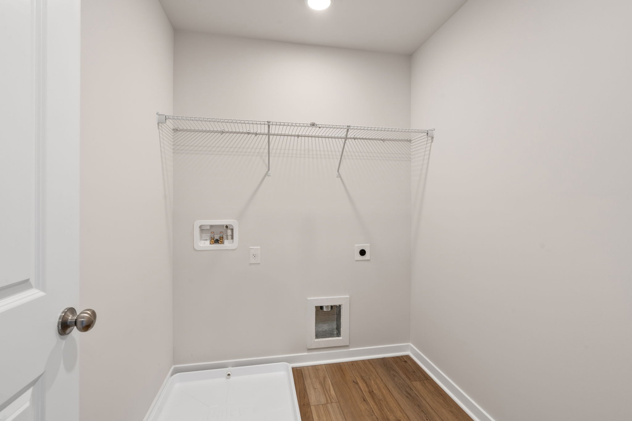 A bathroom with a shower unit.
