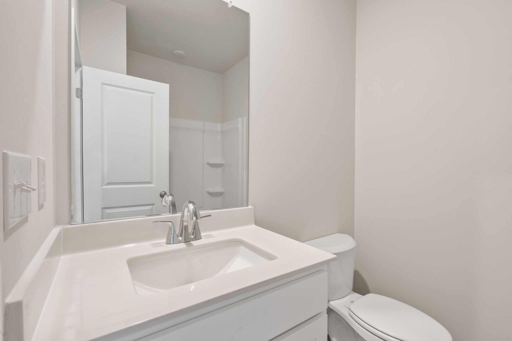 A bathroom with a sink and toilet.